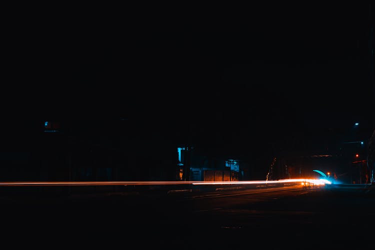 Light Streaks On Dark Road