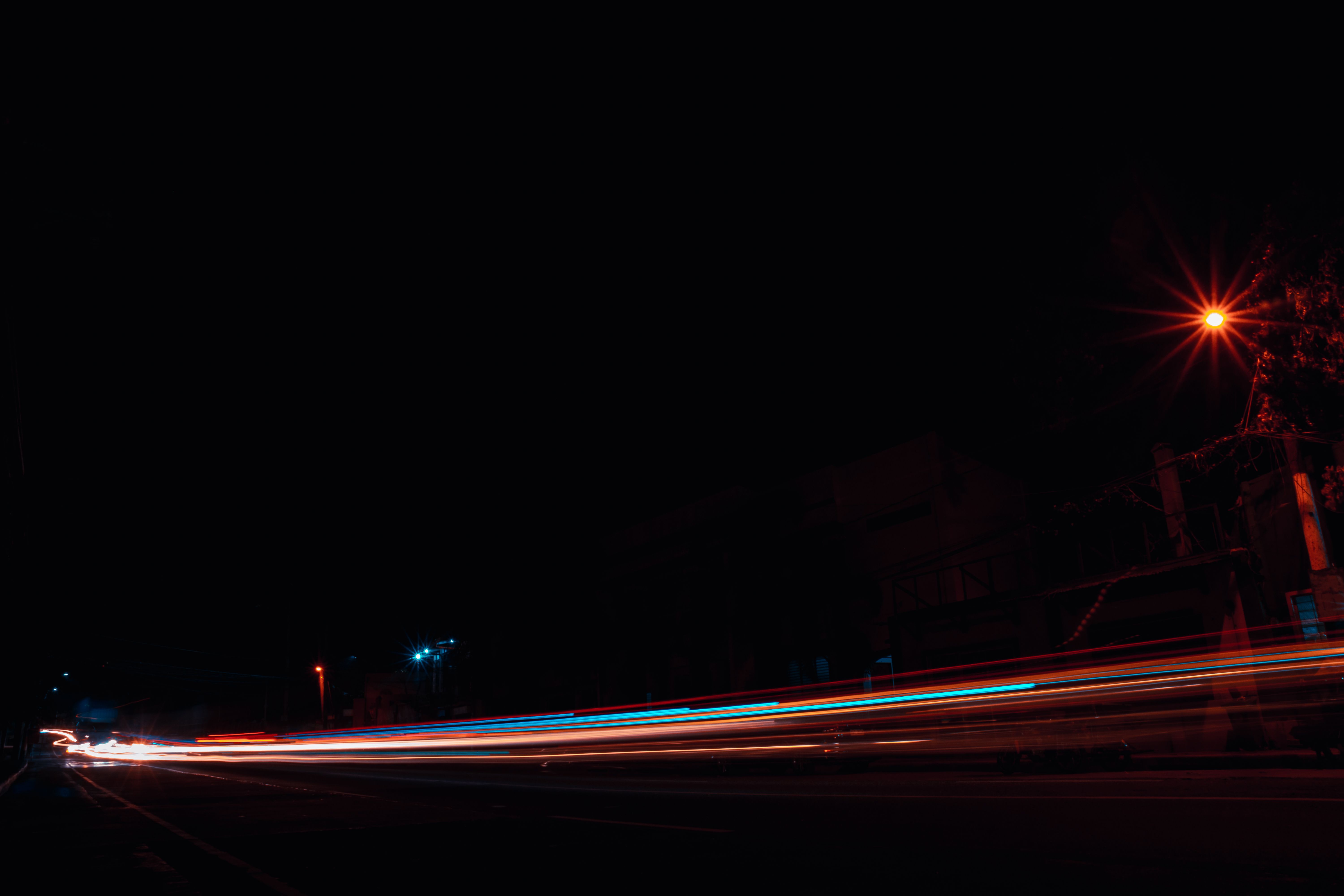 Multi Colored Light Streaks on Dark Background · Free Stock Photo