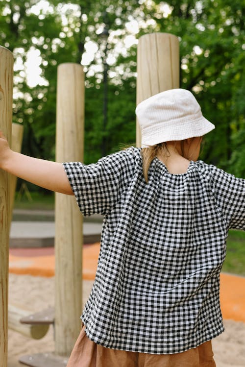 Back View of a Girl Wearing Gingham Top and Bucket Hat 