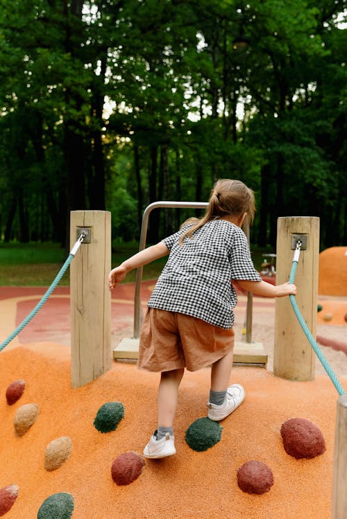 Free Girl Playing at the Playground Stock Photo