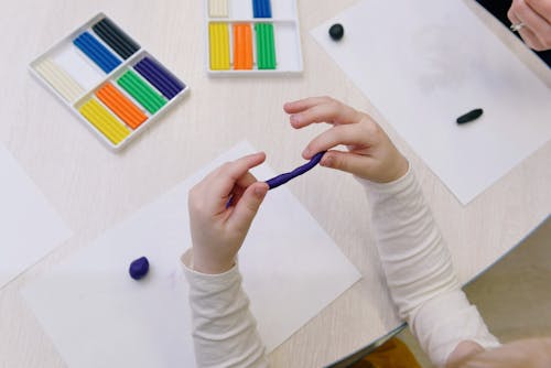 Person Holding Blue Modelling Clay