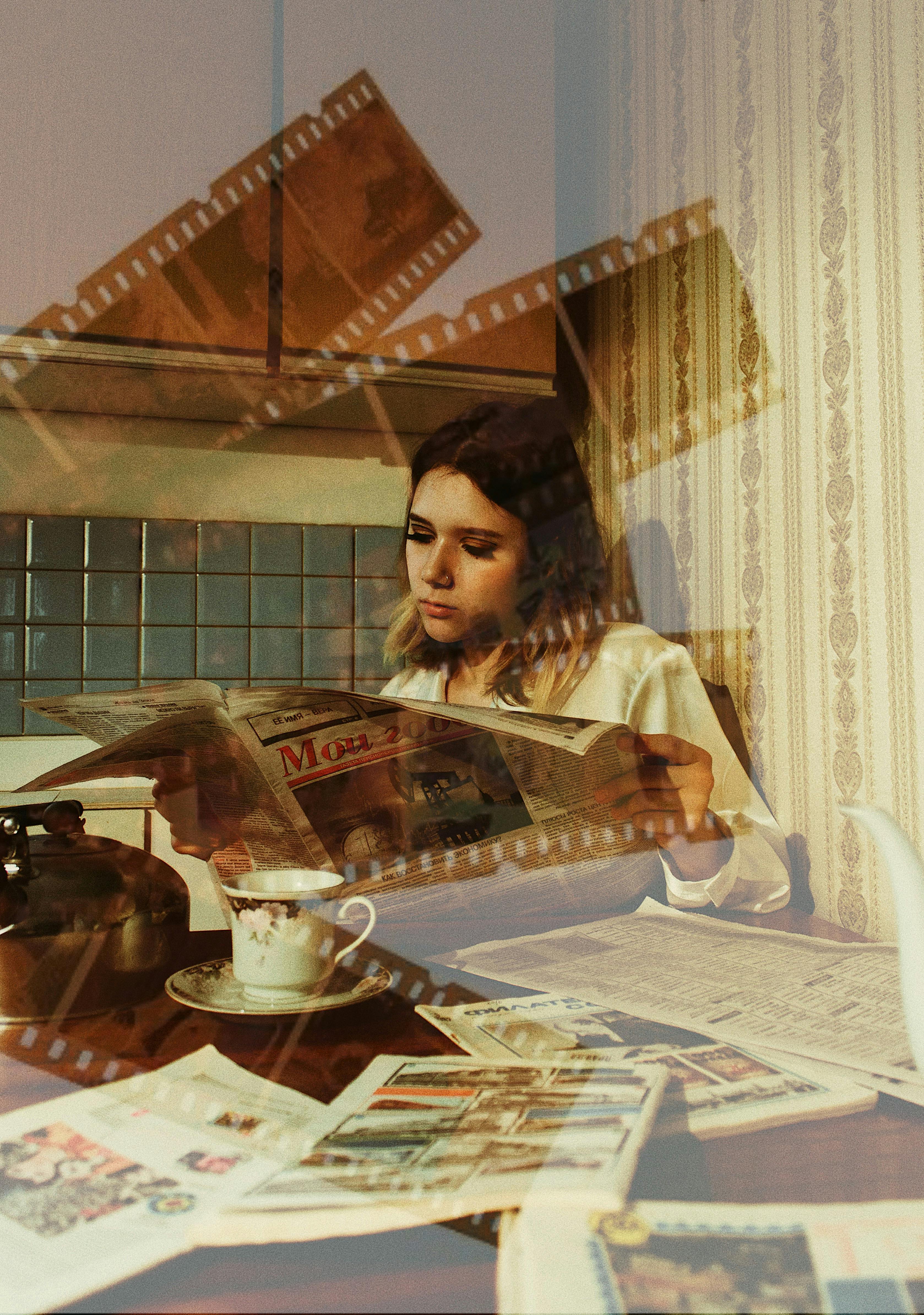 Woman sitting in a vintage kitchen reading a newspaper surrounded by nostalgic elements and film strips.