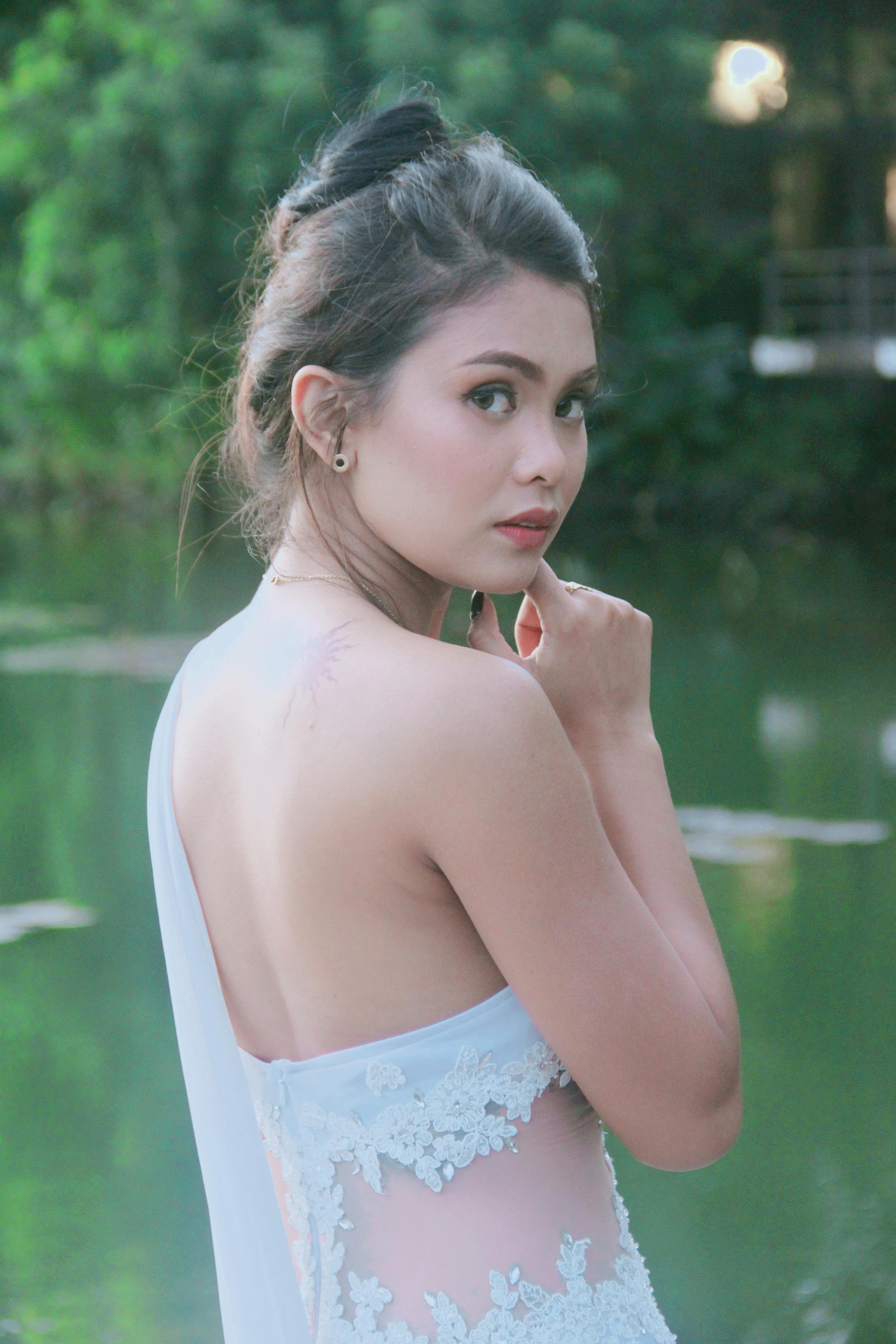 woman in white bare back and shoulder clothing