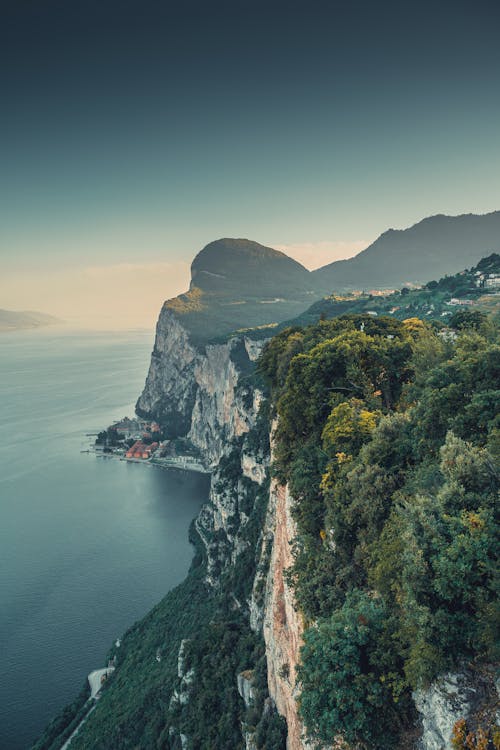 Aerial Photography of Cliffs Beside the Sea Under Blue Sky