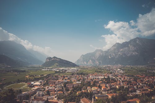 Free An Aerial Photography of a City Near the Mountains Stock Photo