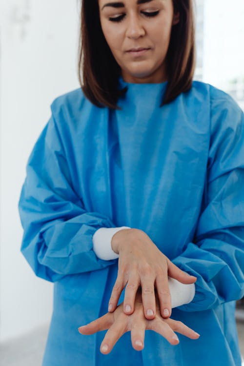 Woman Wearing a Blue PPE