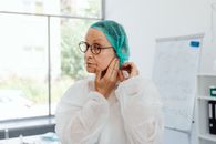 Woman in White Robe Wearing Eyeglasses