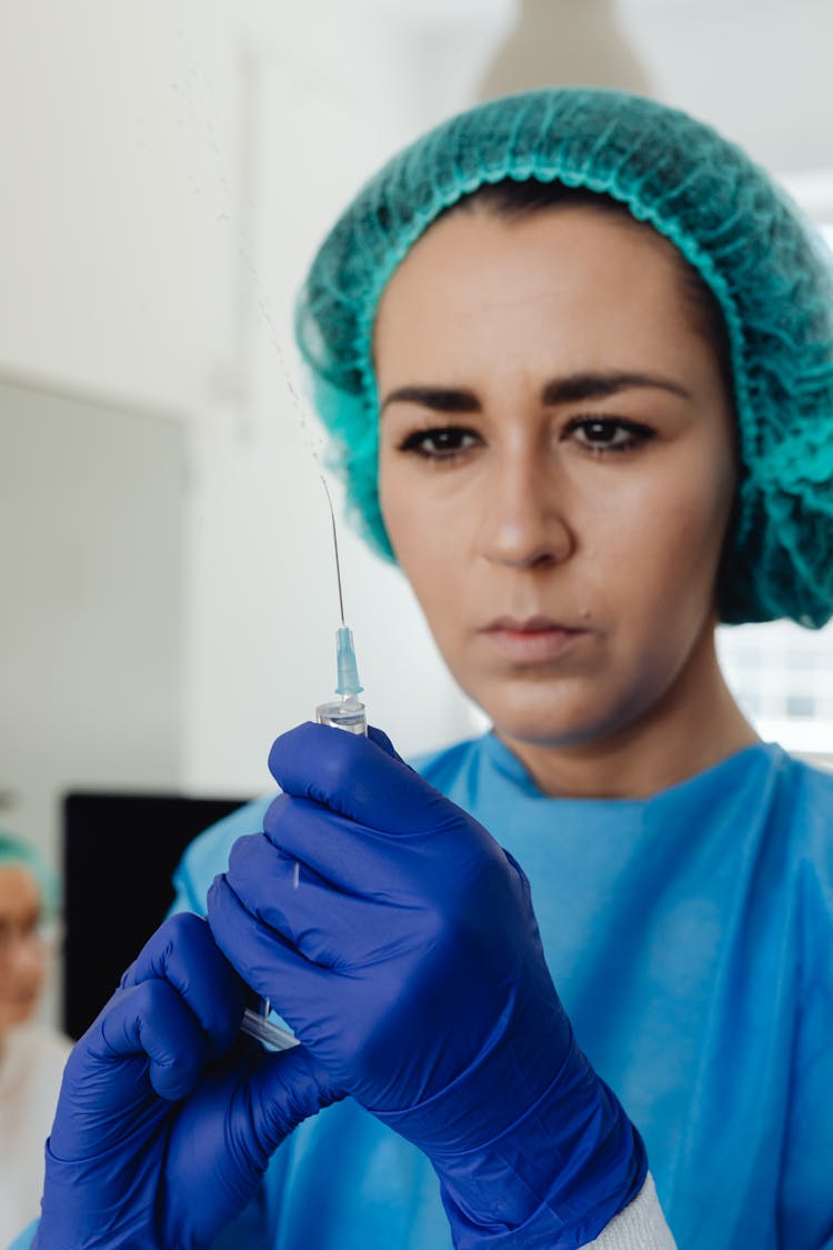 Woman Holding A Syringe