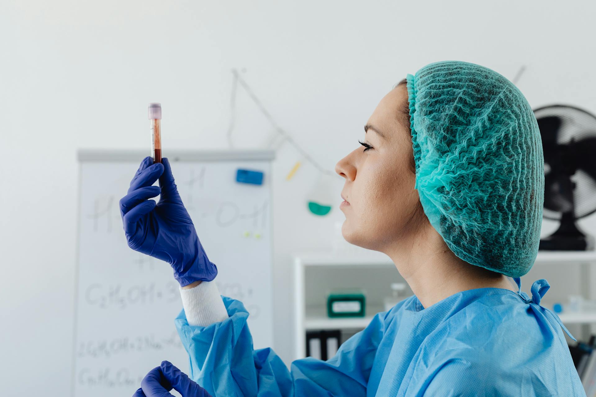 Woman Checking the Blood Collection Tube