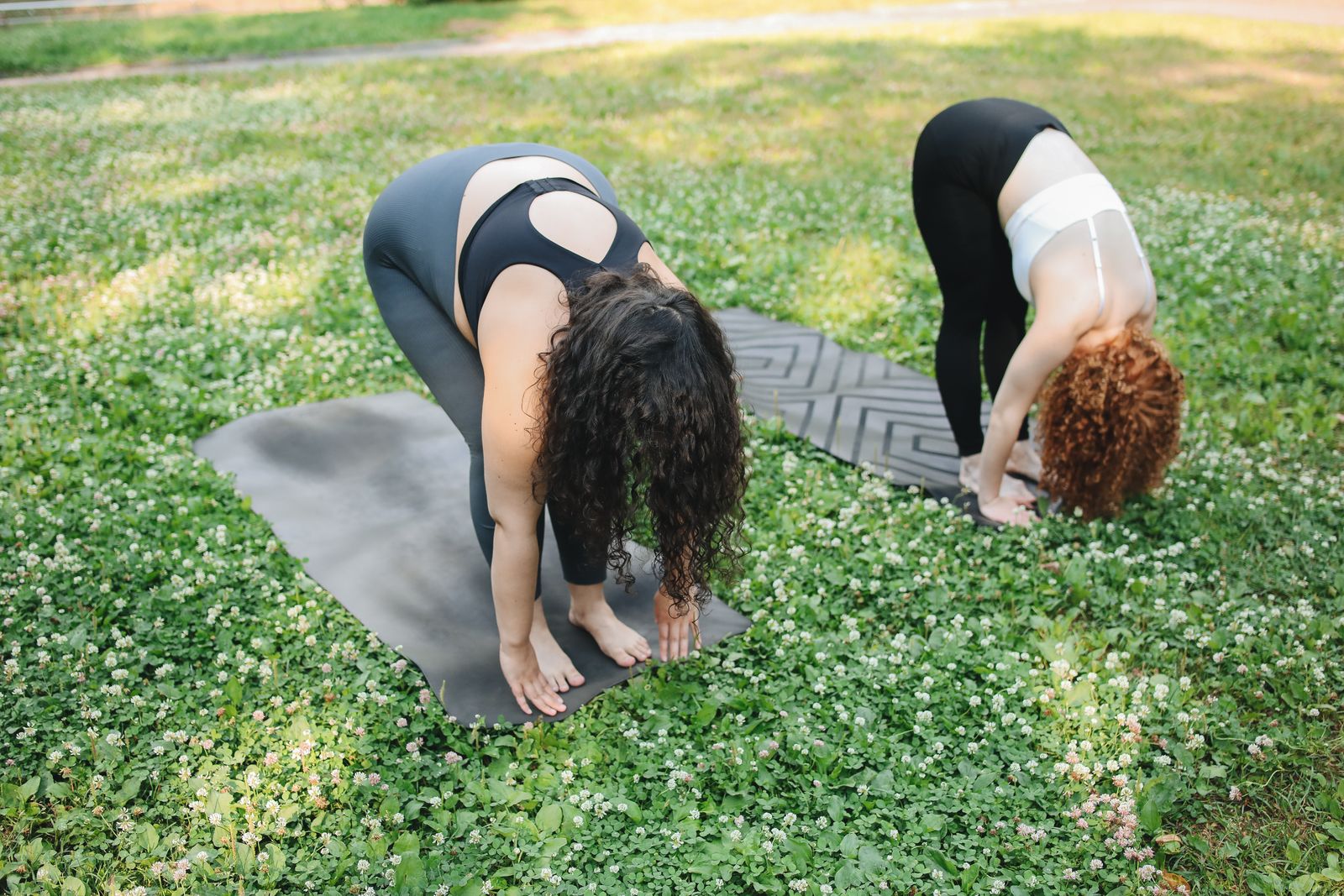 Person stretching the lower back on a bright mat before choosing back support