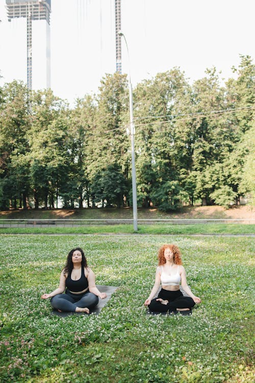 Two Women Meditating Outdoors