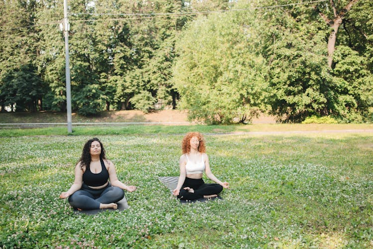 A Women Doing Yoga Together