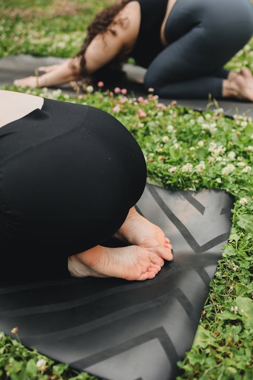 Close-Up Shot of Person Doing Yoga on Grass