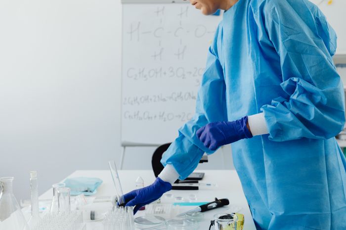 Laboratory professional handling sample tubes