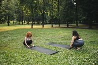 Women Putting Down a Yoga Mat