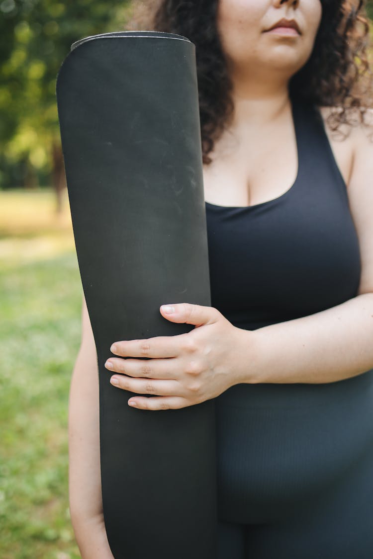 Woman Holding A Yoga Mat