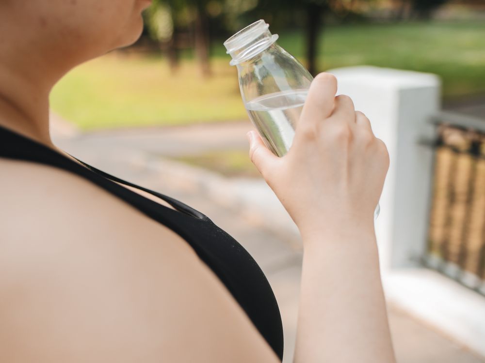 Woman holding a water bottle