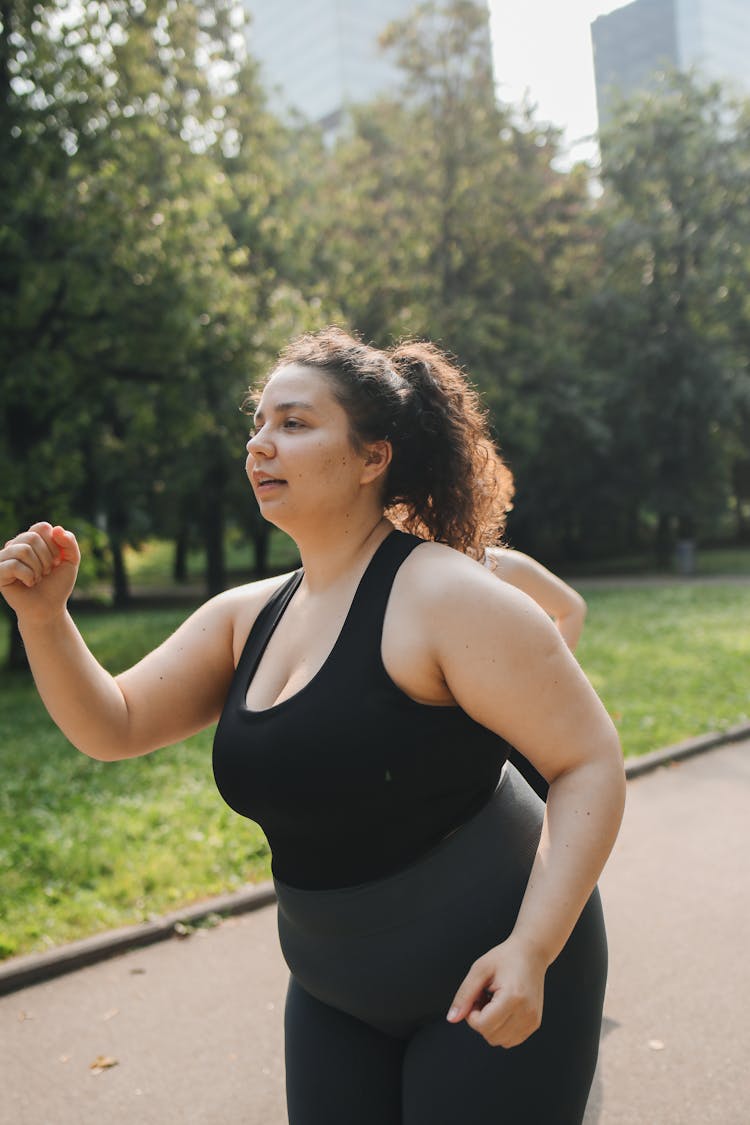 Woman Running In The Park 