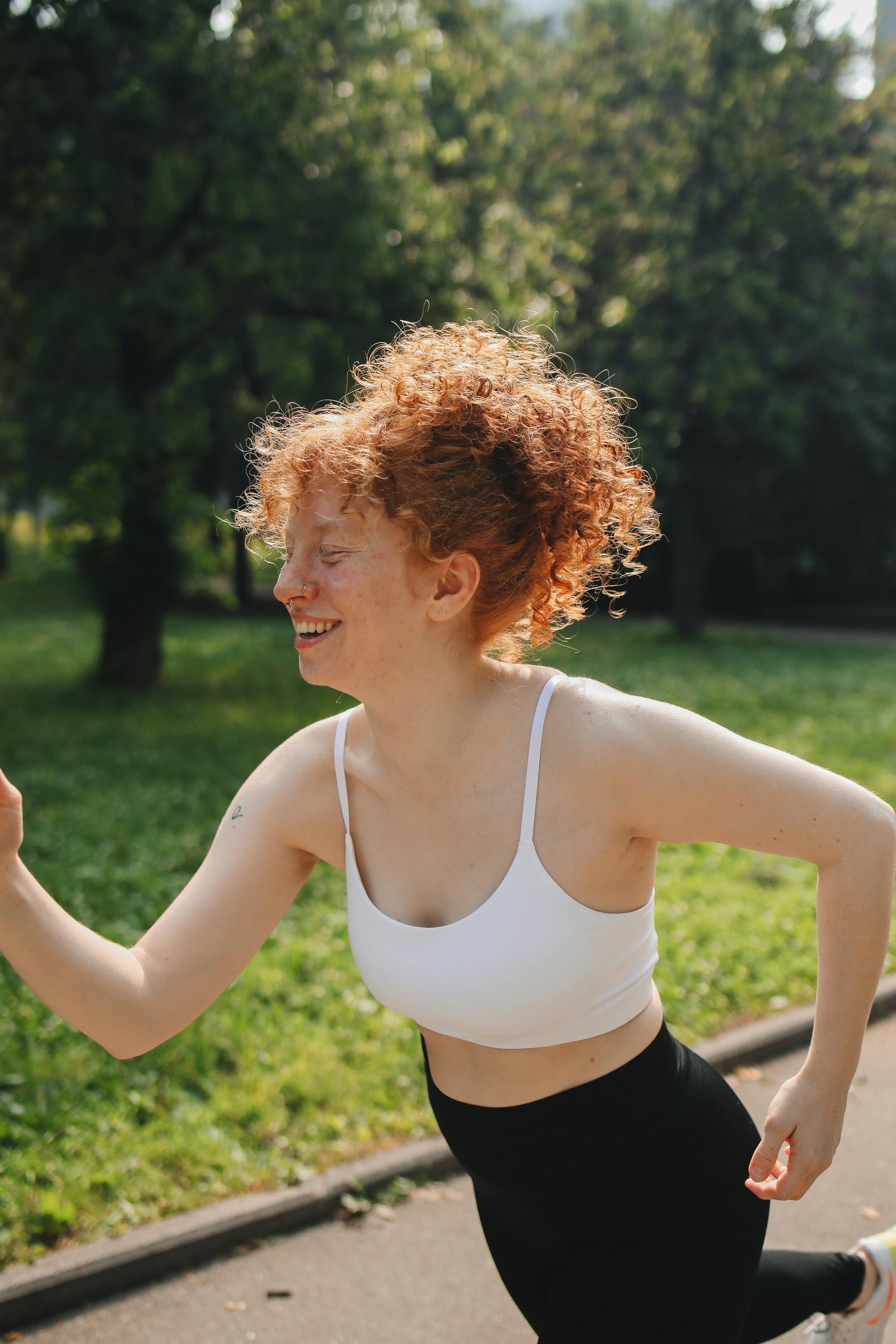 Woman in White Sport Bra Running at the Park · Free Stock Photo