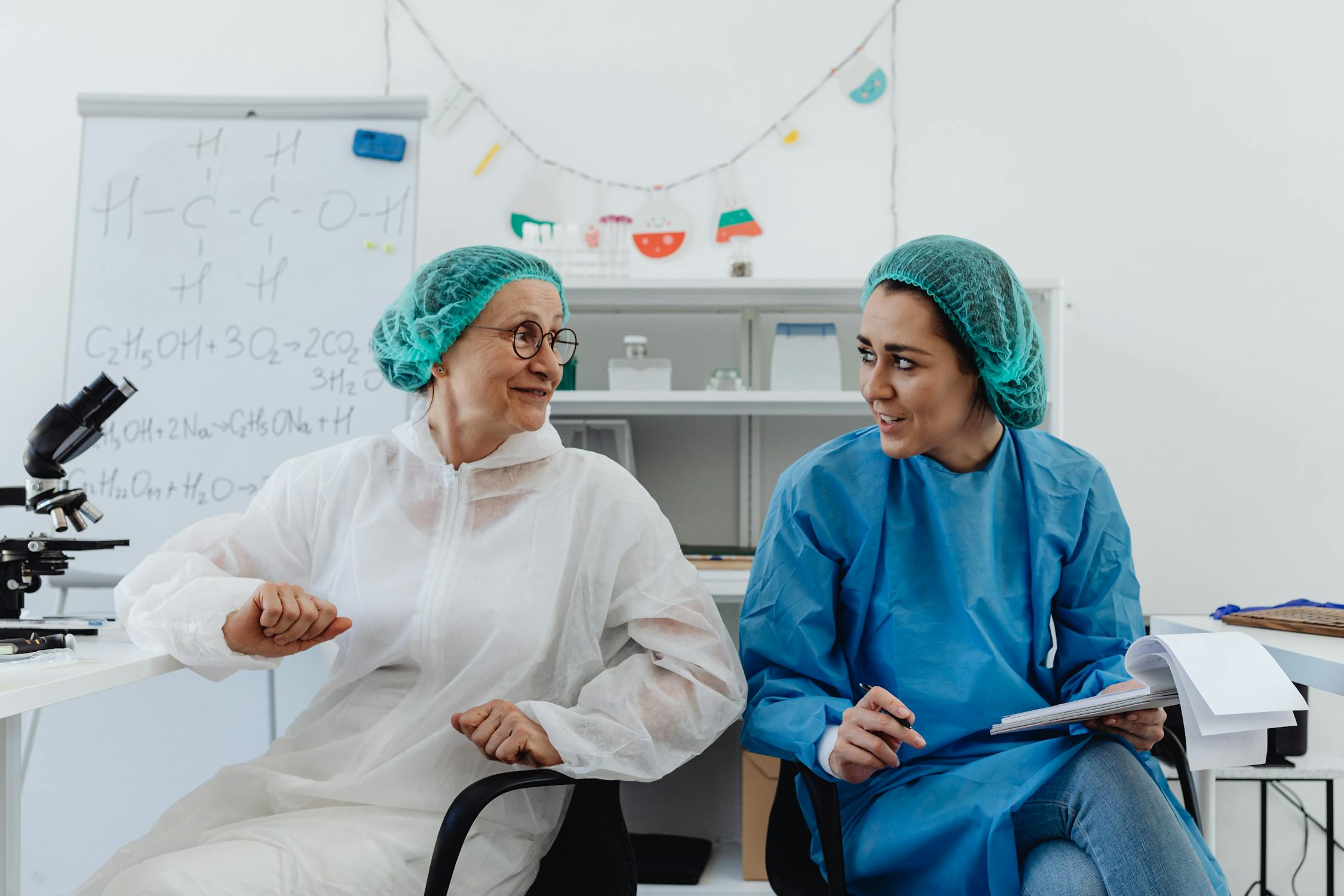  two researchers in discussion during a clinical trial. 