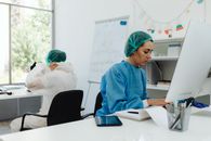People Wearing Scrub Suits while Working