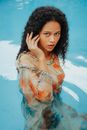 Woman in White and Orange Floral Dress