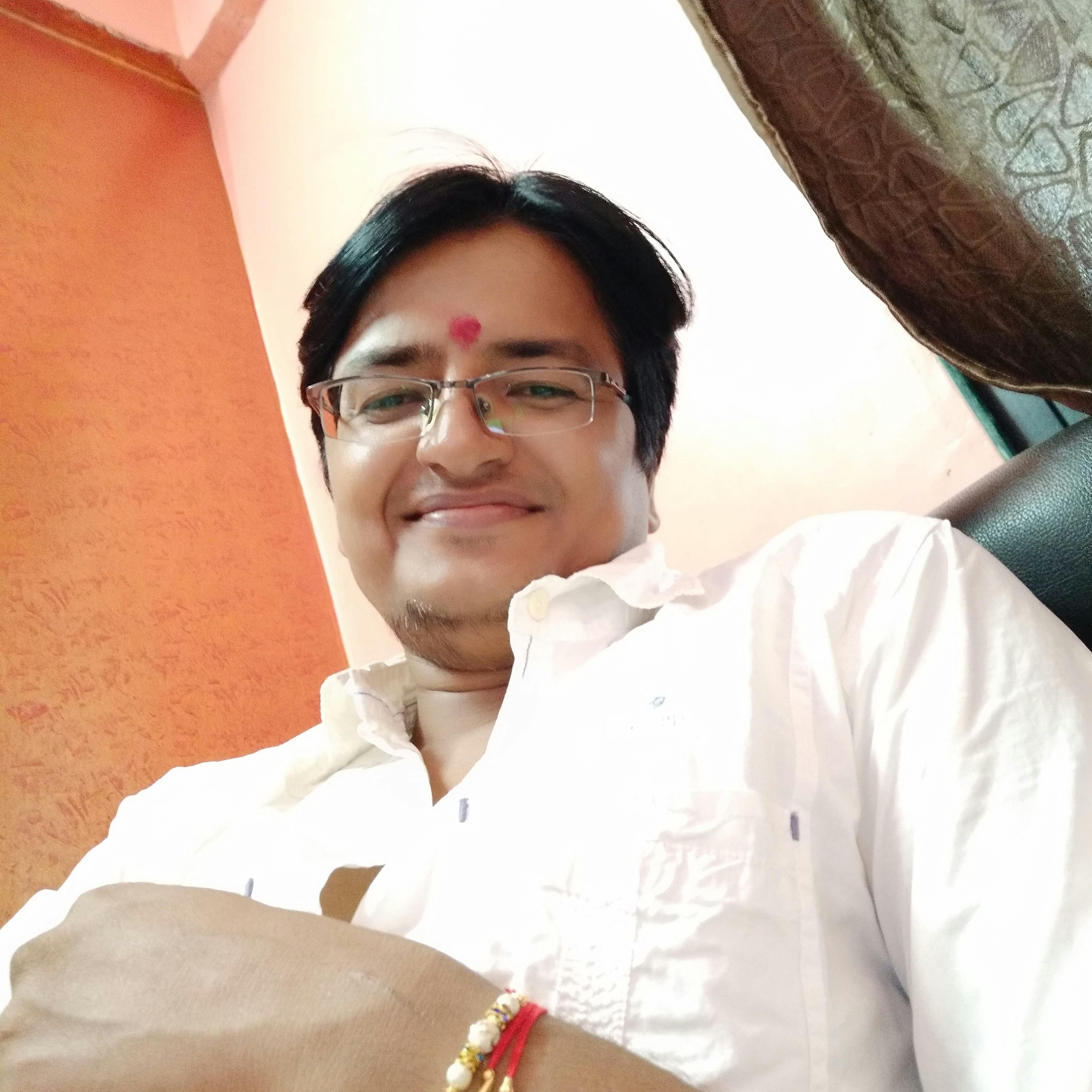 Scientist holding a volumetric flask and pipette