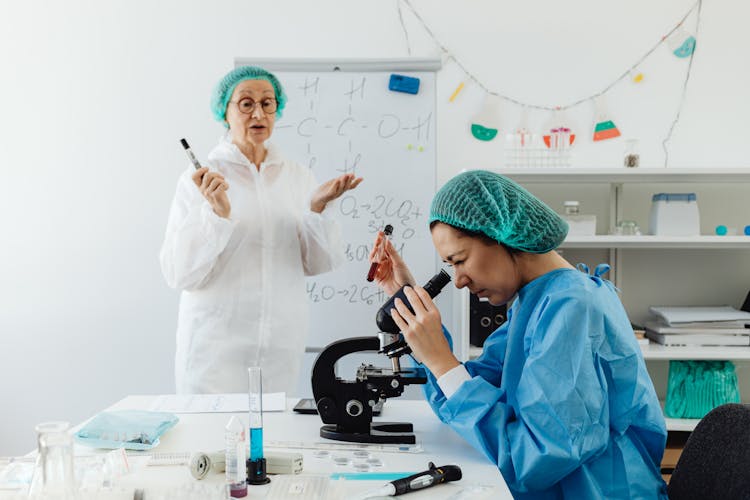 Women Inside A Laboratory Doing Research And Analysis