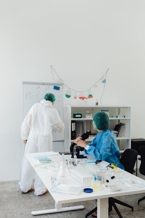 Scientists in Lab Coat Doing Research