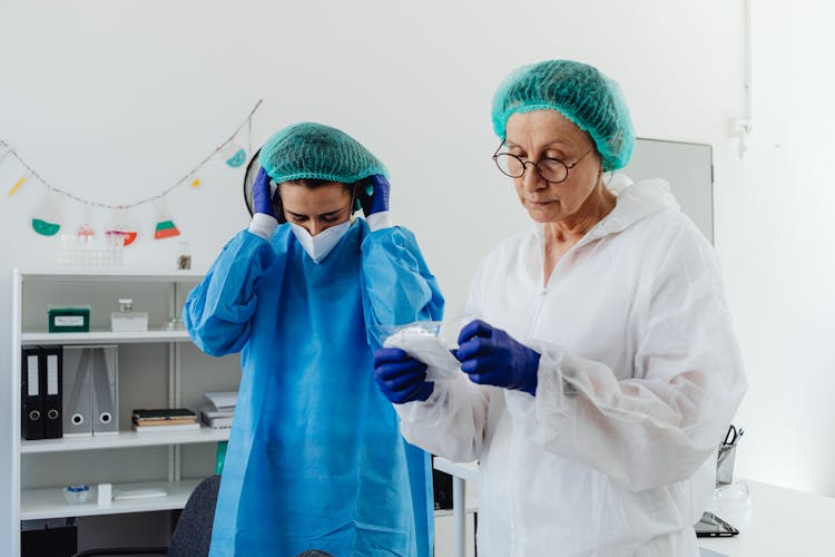 Women In Laboratory Wearing Protective Gears