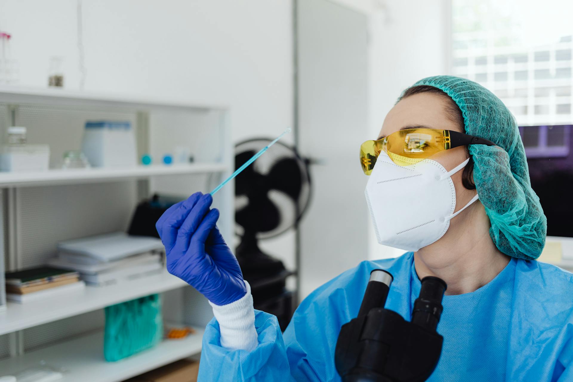 Close-Up View of a Woman Analyzing a Sample