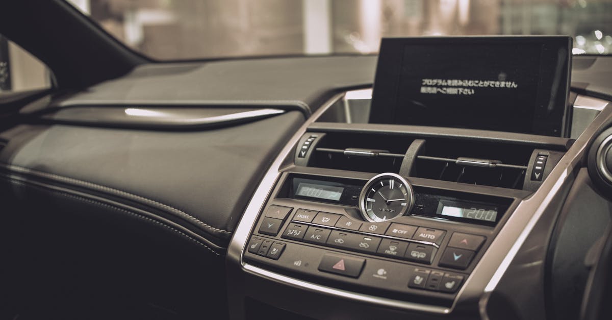 Close-up of a Lexus car interior showcasing the sleek dashboard and modern features.