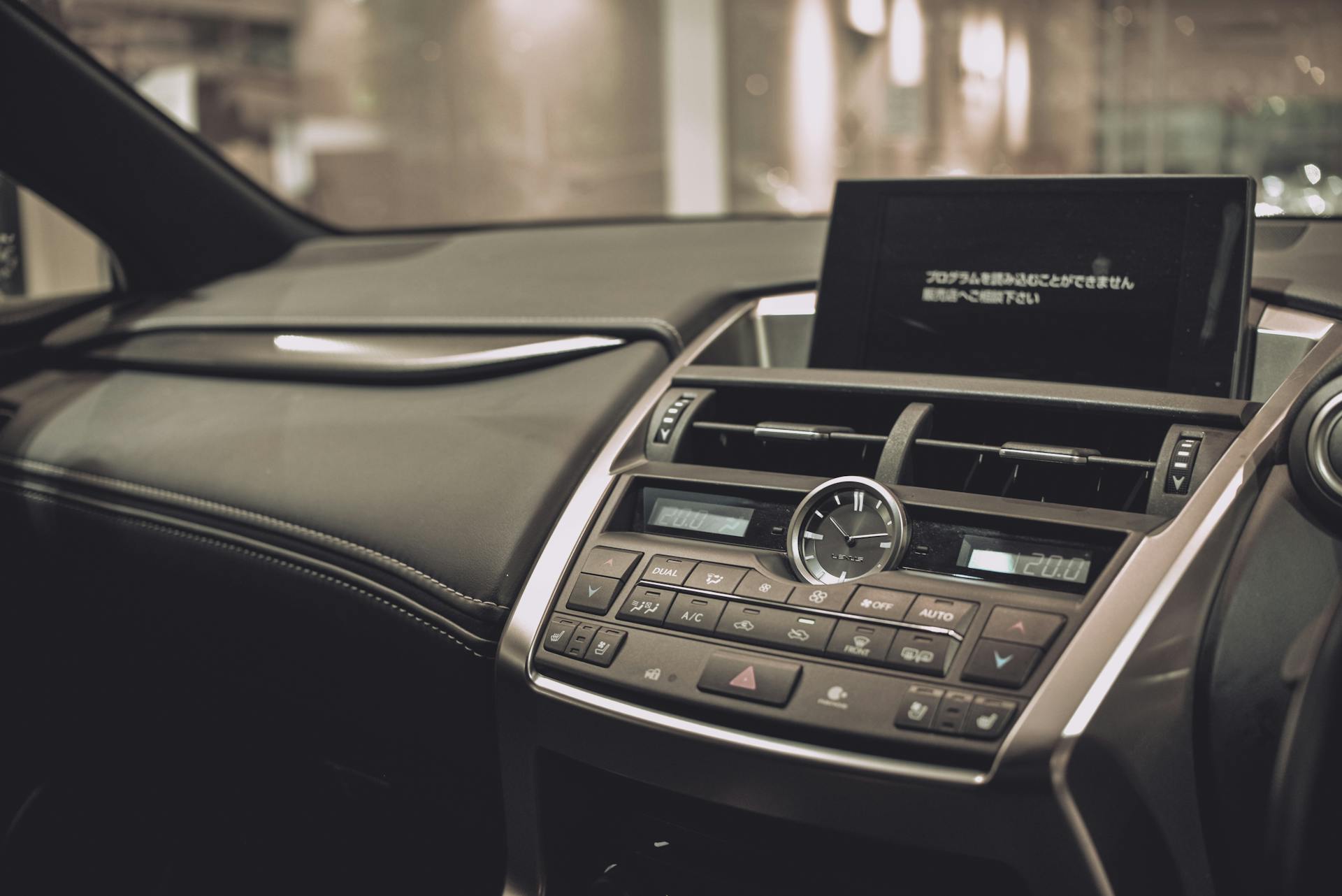 Close-up of a Lexus car interior showcasing the sleek dashboard and modern features.