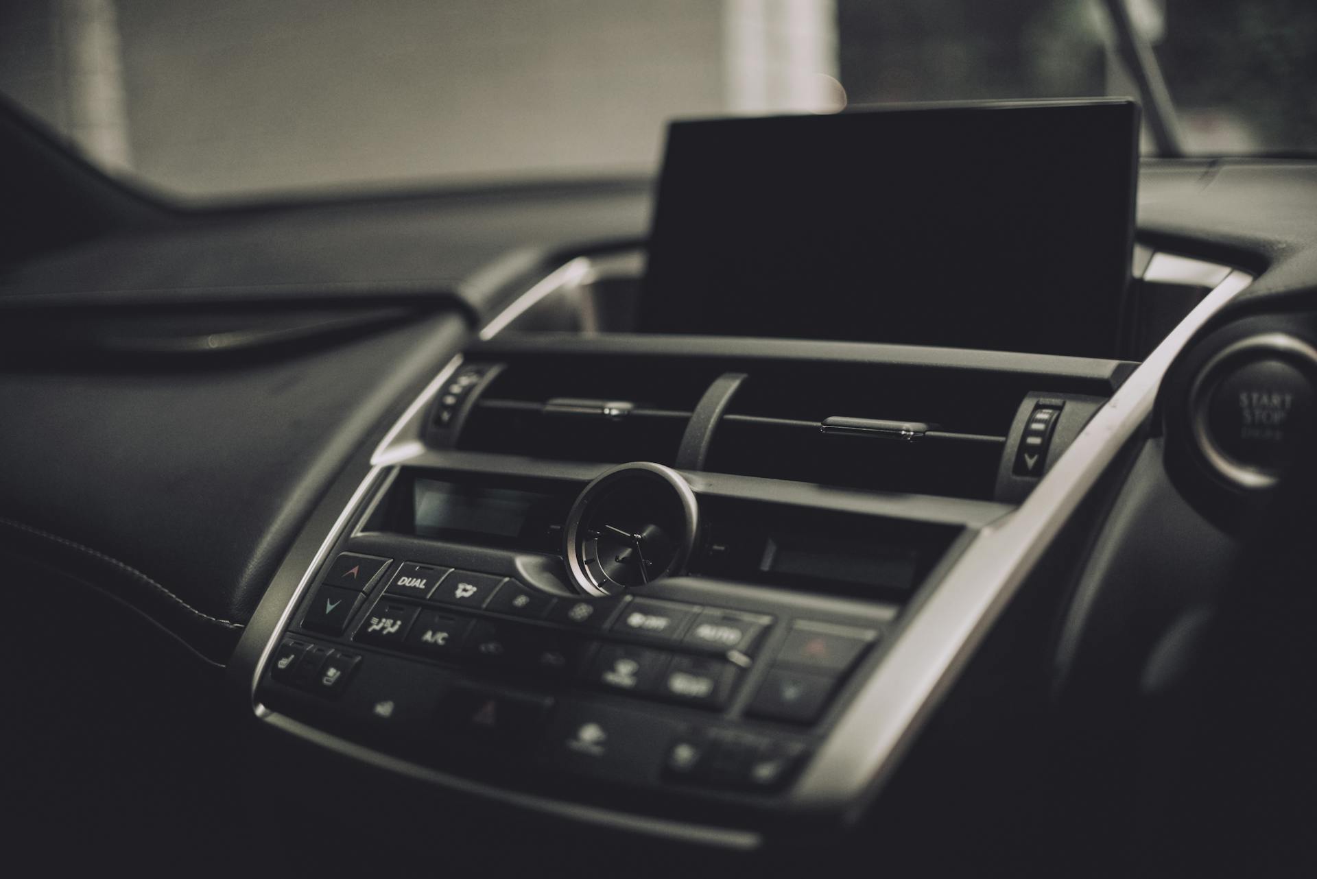 Elegant interior view of a Lexus NX dashboard featuring modern design and technology elements.