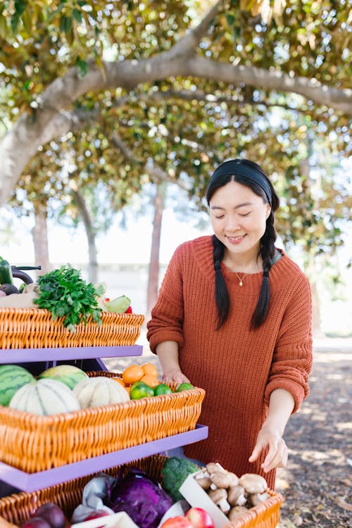 Smiling Woman Buying Vegetables 