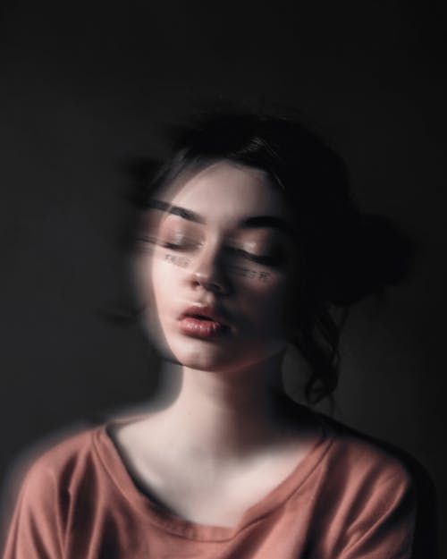 Calm young woman with closed eyes