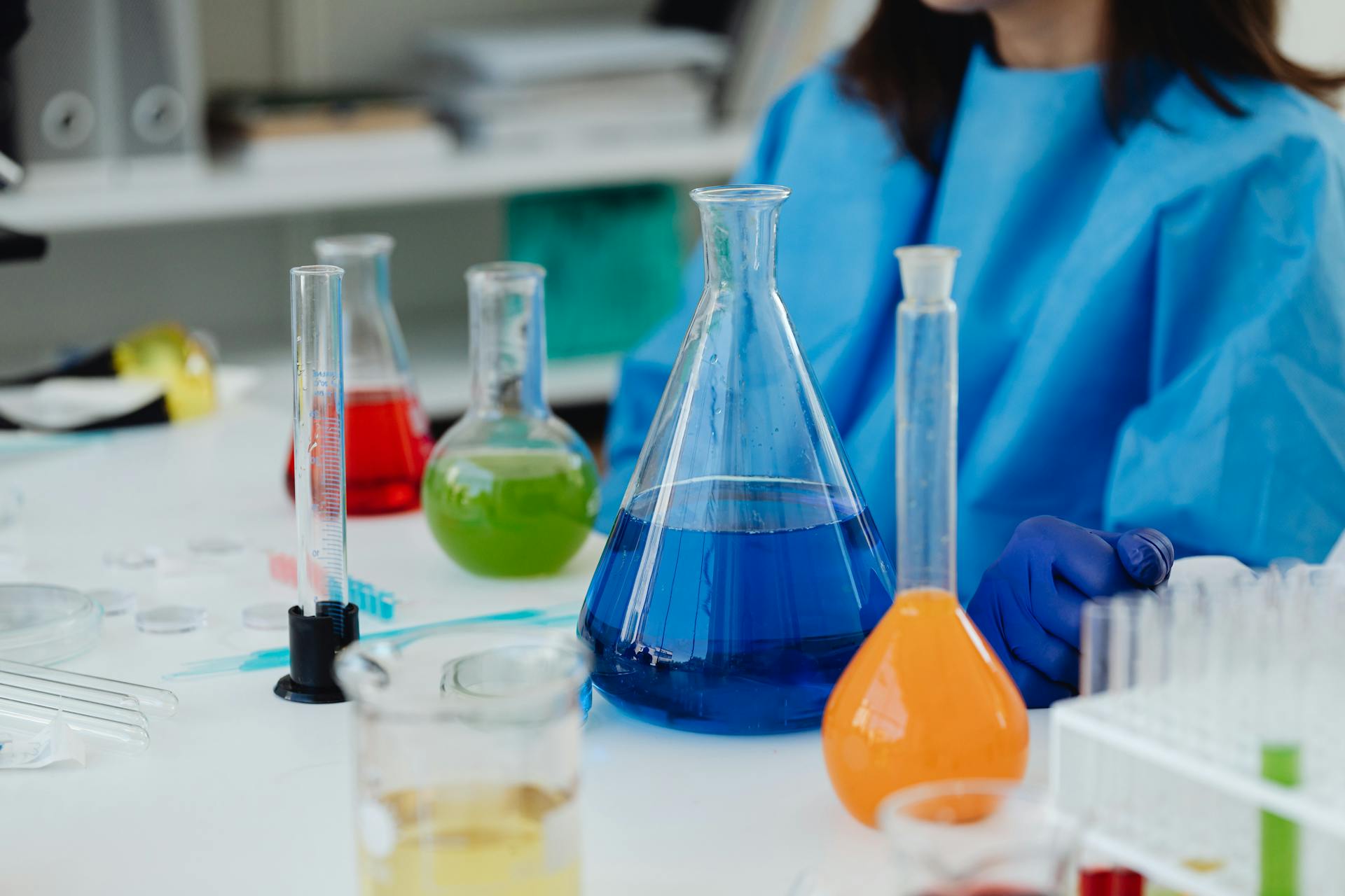 Glassware with Colorful Liquid Substances on a Lab Desk