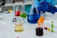 Clear Glass Beakers on White Table