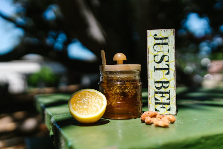 
A Close-Up Shot Of A Glass Container With Honey