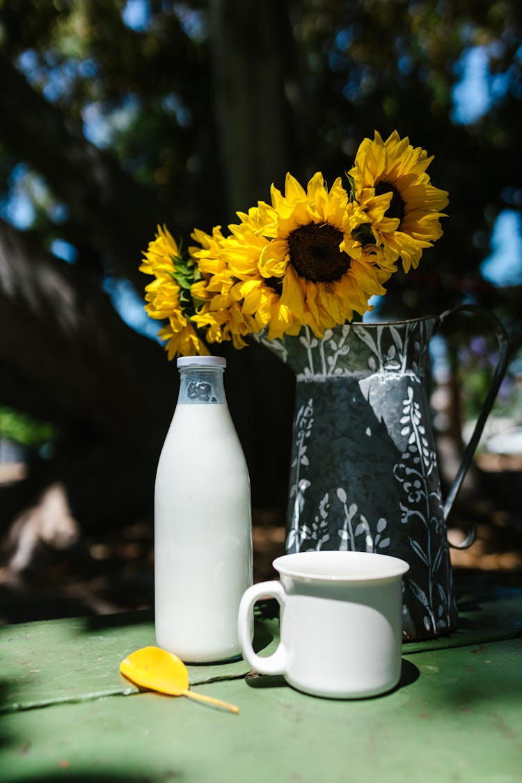 Sunflowers In A Metal Pitcher