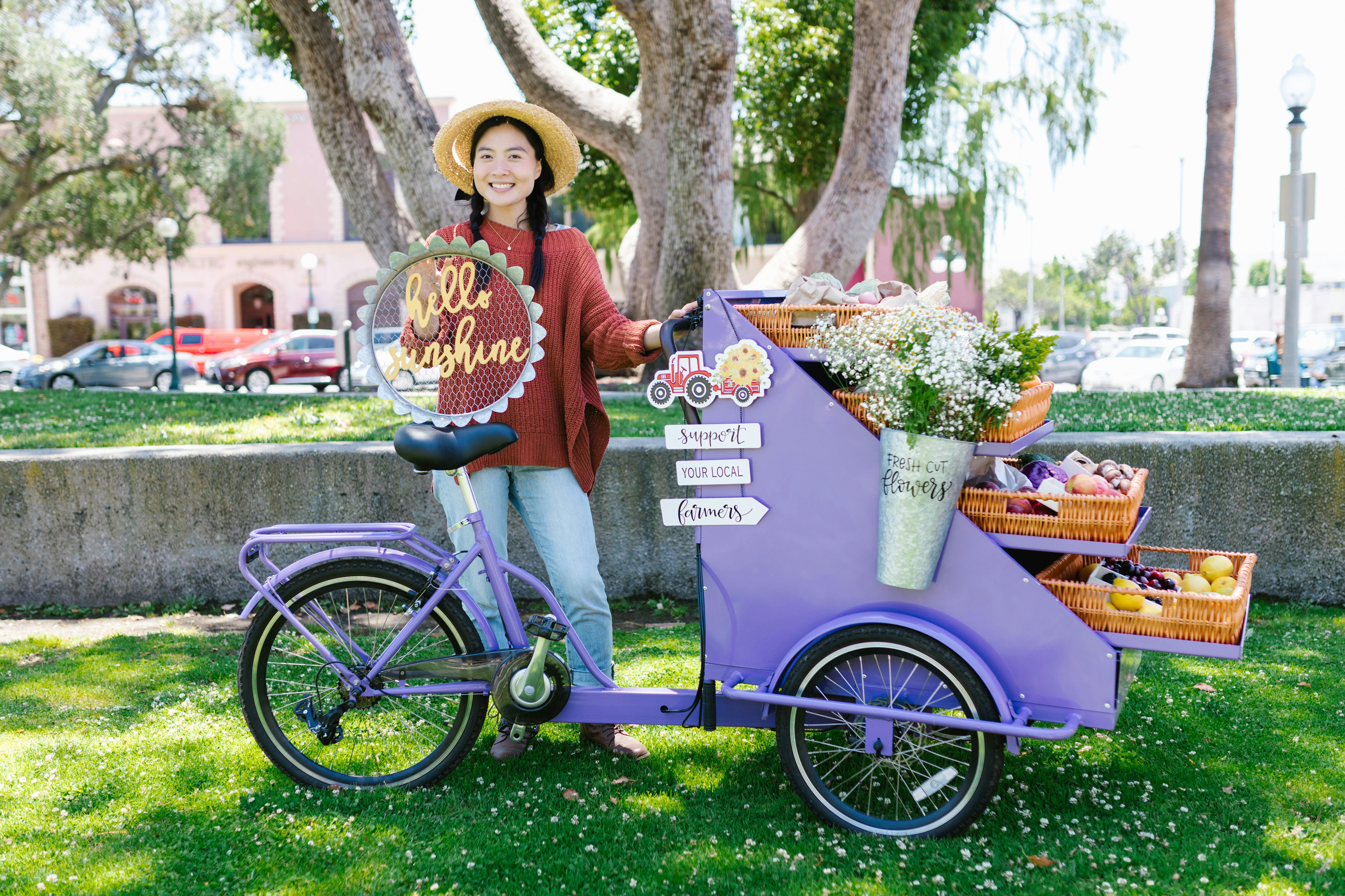 woman selling fruits and flowers in a park