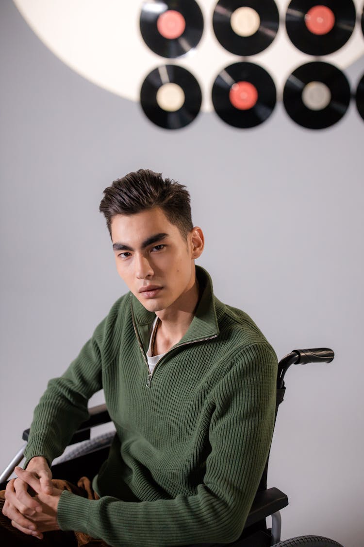 Handsome Man Sitting On A Wheelchair 