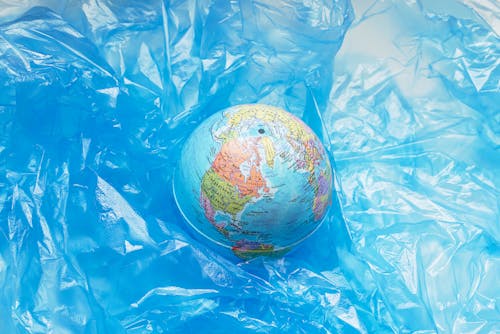 Free Plastic Around a Globe Stock Photo