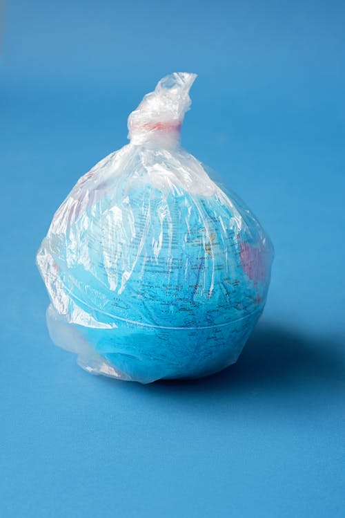 Close-up Photo of a Globe in a Plastic 