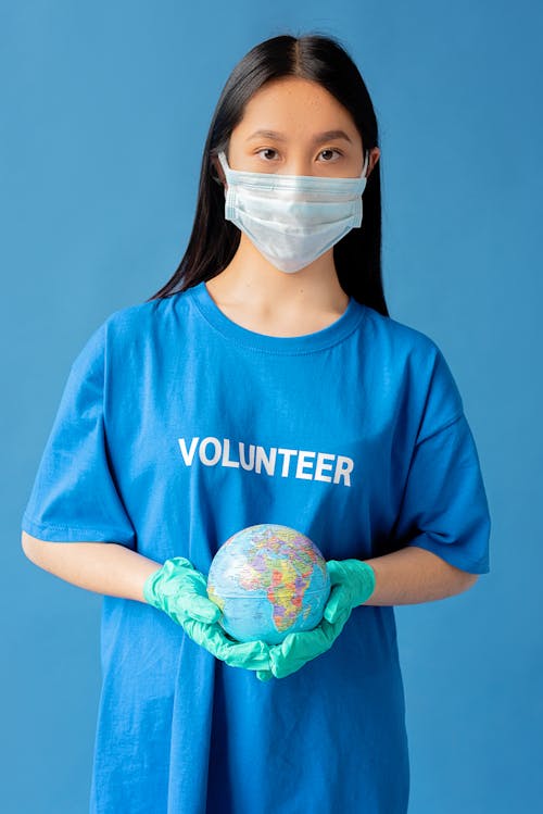 A Woman Holding a Globe