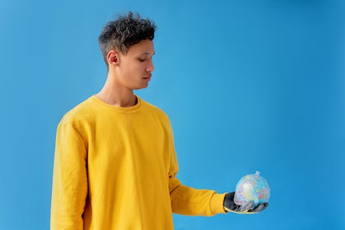 A Man Holding a Globe