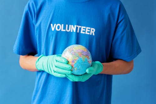 Close-Up Shot of Person Holding a Globe