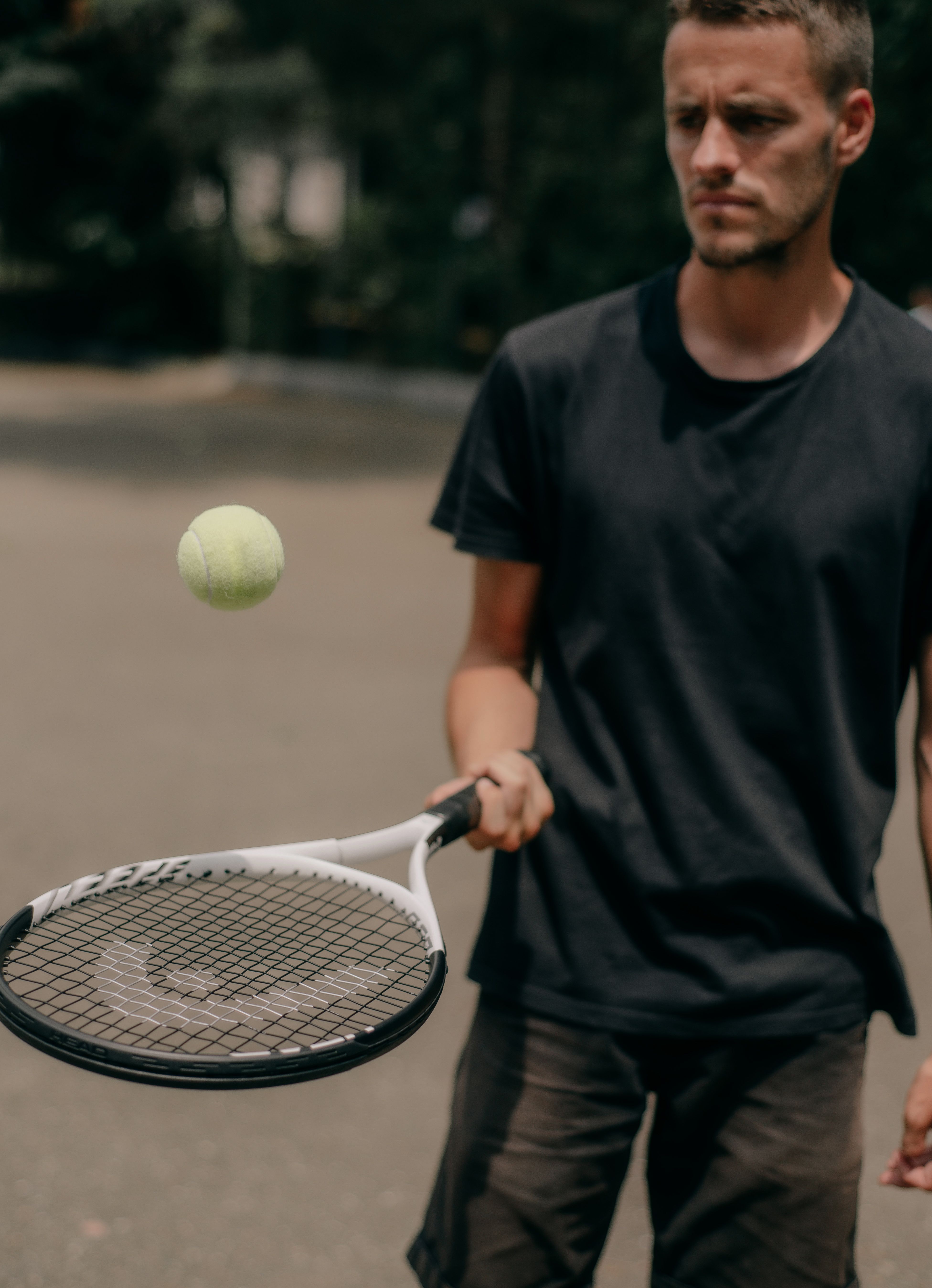 A Man using a Tennis Racket and Tennis Ball · Free Stock Photo