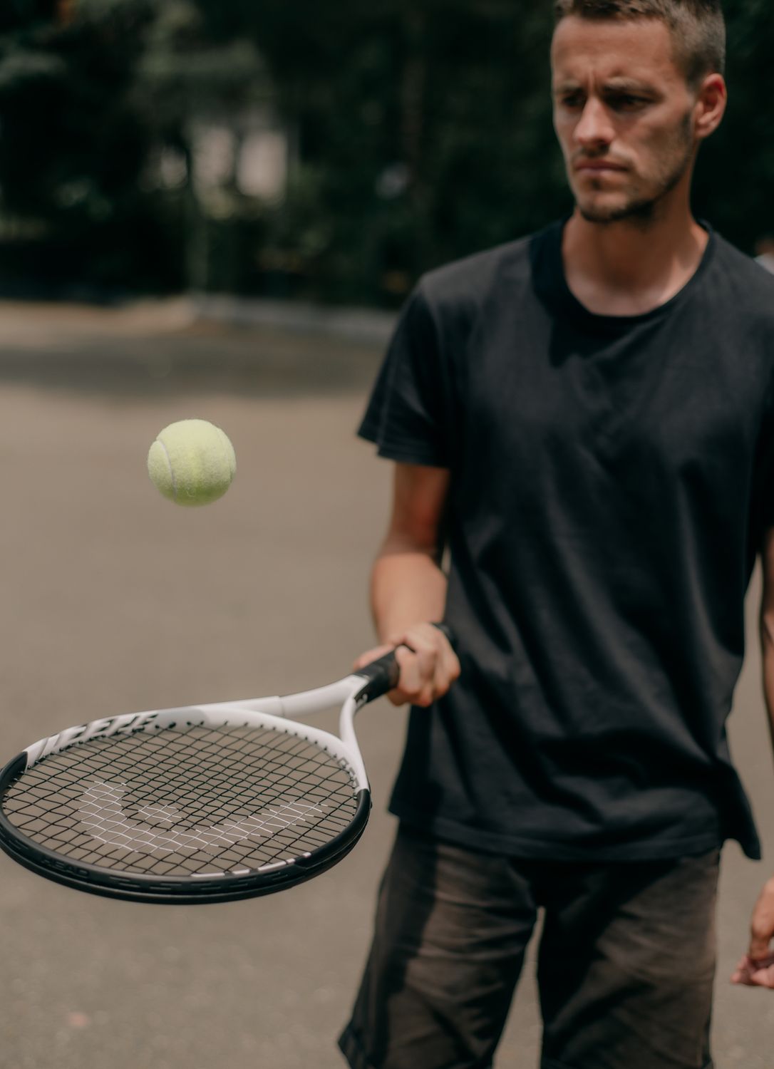 Man Using Tennis Racket A Man using a Tennis Racket and Tennis Ball · Free Stock Photo
