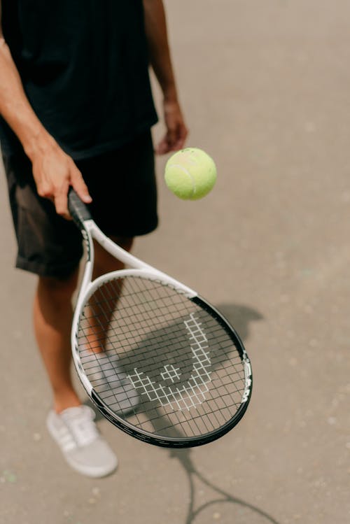 Free A Person Holding a Tennis Racket Stock Photo